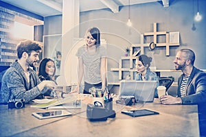 Female graphic designer having discussion with coworkers