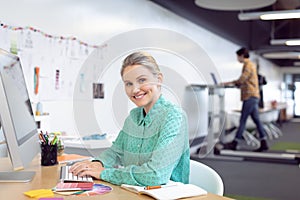 Female graphic designer working on computer