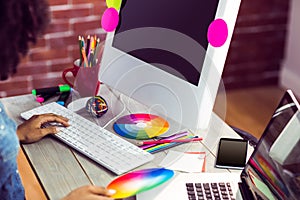 Female graphic designer working at desk