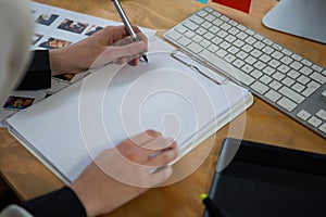 Female graphic designer working at desk