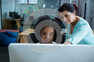 Female graphic designers using desktop pc