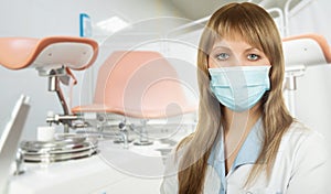 Female gynecologist in protective mask