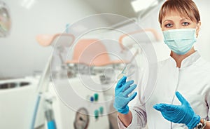 Female gynecologist in protective mask