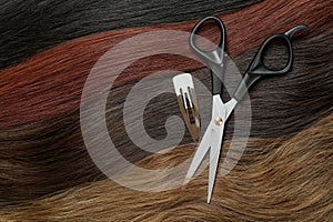 Female hair, hair clip and scissors, close up