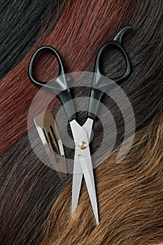 Female hair, hair clip and scissors, close up