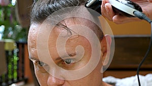 Female Hairdresser Making Stylish Haircut For Male Cusomer With Professional Black Electric Corded Hair Clipper