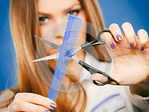 Female hairdresser presenting tools