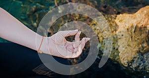 Female hand in aakaash mudra yogic gesture