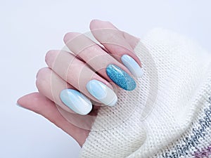 Female hand beautiful fashion design stylish ombre acrylic manicure, sweater, winter