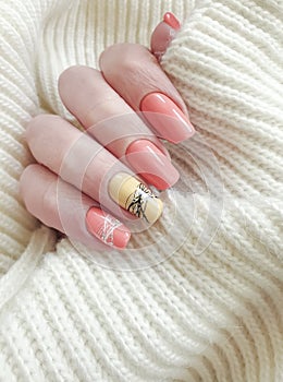 Female hand beautiful manicure sweater