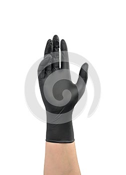 Female hand in a black latex glove raised up. Body part isolated on white background