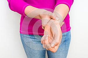 Female hand checking heart rate pulse on wrist