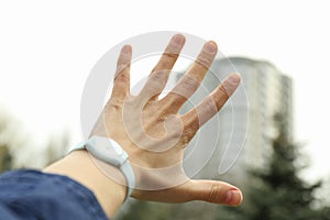 Female hand with clock on blurred background