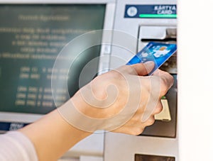 Female hand - close up - cash withdrawals at ATMs