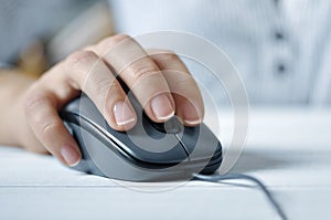 Female hand with computer mouse