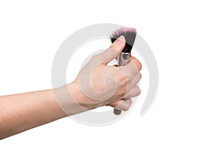 In female hand cosmetic brush for make-up is isolated on white b