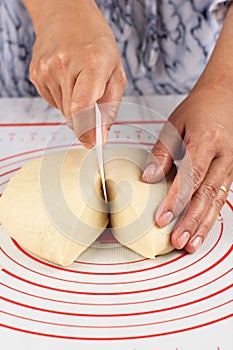 Female Hand Divided Bread or Pizza Dough into Smaller Pieces, Step by Step Making Bread