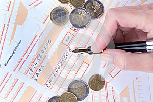 Female hand filling Remittance slip photo