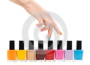 Female hand fingers are the colored paints polish