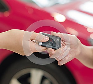 Female hand getting modern car key photo