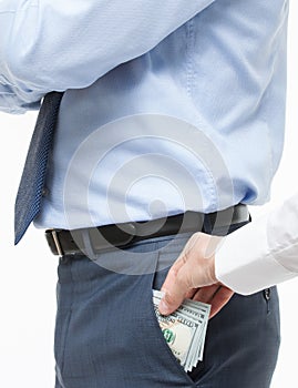 Female hand giving a bribe to businessman