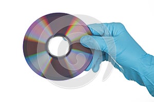 Female Hand in glove with dvd