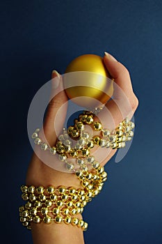 Female hand in gold