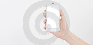 Female hand hold mobile phone isolated on white, woman holding phone with empty display,blank screen,touching