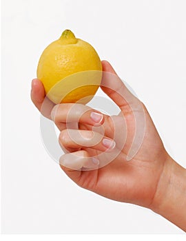 Female hand hold a yellow lemon