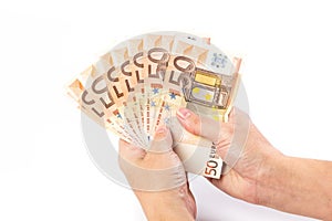 Female hand holding 50 euro banknotes