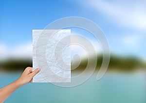 Female Hand Holding a Blank paper