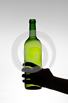 Female hand holding a bottle