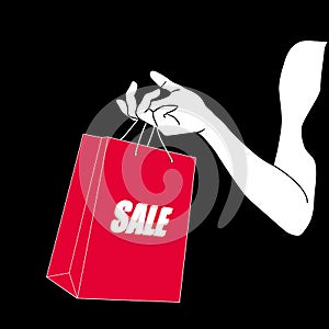 Female hand holding bright red shopping bag. A paper package with text sale in painted hand of young woman. Sale, Black