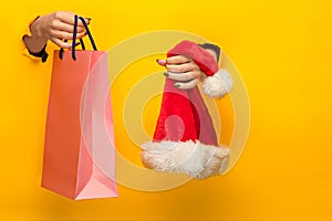 Female hand holding bright shopping bag