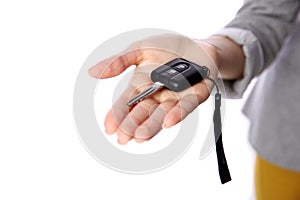 Female hand holding car keys