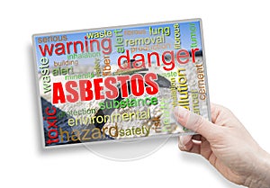 A female hand holding an card with asbestos theme