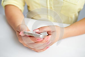 Female hand holding a cell phone