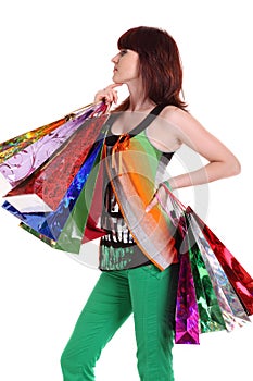 Female hand holding colorful shopping bags