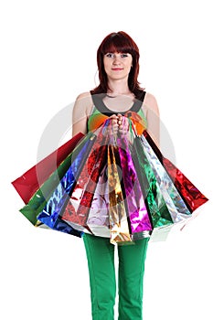 Female hand holding colorful shopping bags