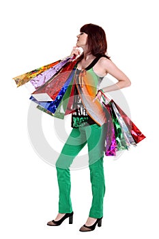 Female hand holding colorful shopping bags