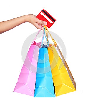 Female Hand Holding Colorful Shopping Bags and Credit Card