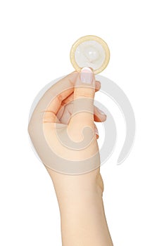 Female hand holding condom