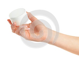 Female hand holding cosmetic cream jar isolated with clipping path. Mockup