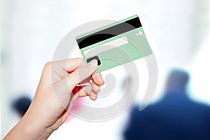 Female hand holding credit card