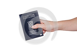 Female hand holding Croatian passport