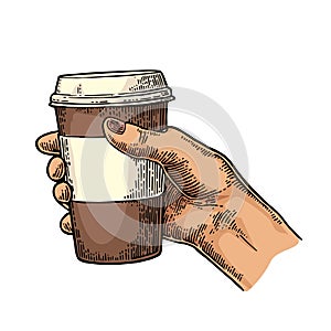 Female hand holding a disposable cup of coffee with cardboard holder and cap.