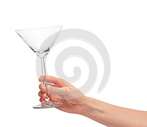 Female hand holding empty clean transparent martini glass