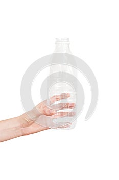 Female hand holding empty plastic bottle isolated on white. Recyclable waste. Recycling, reuse, garbage disposal