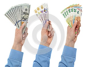 Female hand holding euro, dollars and British pounds currency isolated on white background with clipping path.