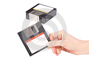 Female hand holding floppy disk